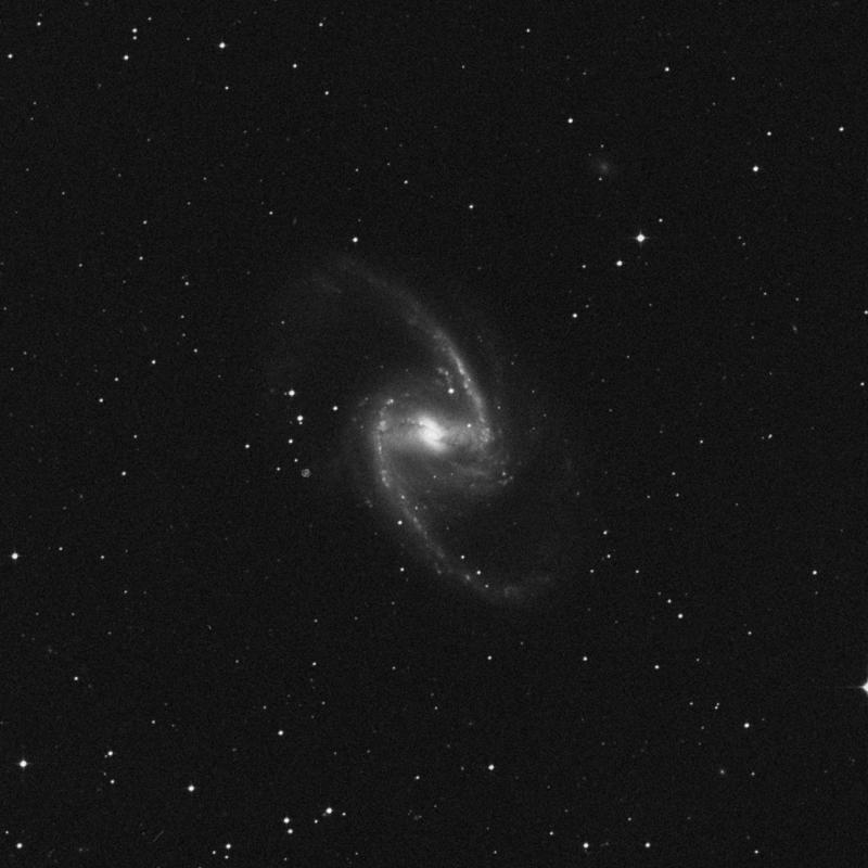imaginea galaxiei spirale NGC 1365 în Steaua Fornax